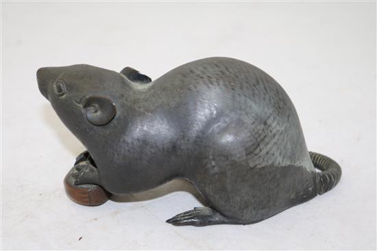 A Japanese bronze model of a rat holding a nut, late 19th century, length 17cm, loss to tail